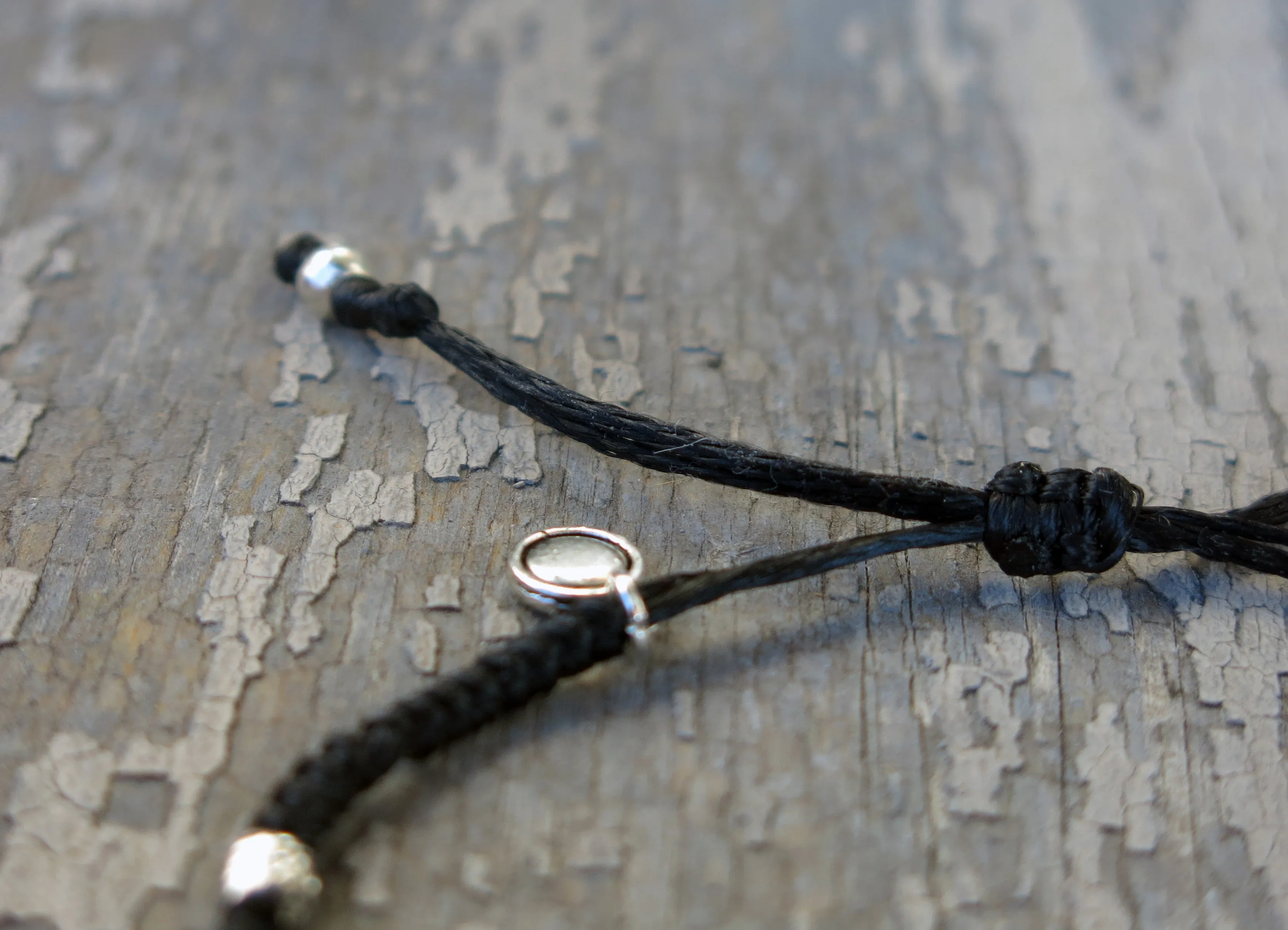AZOE - Minimalist knotted bracelet with adjustable sliding knot for closure.