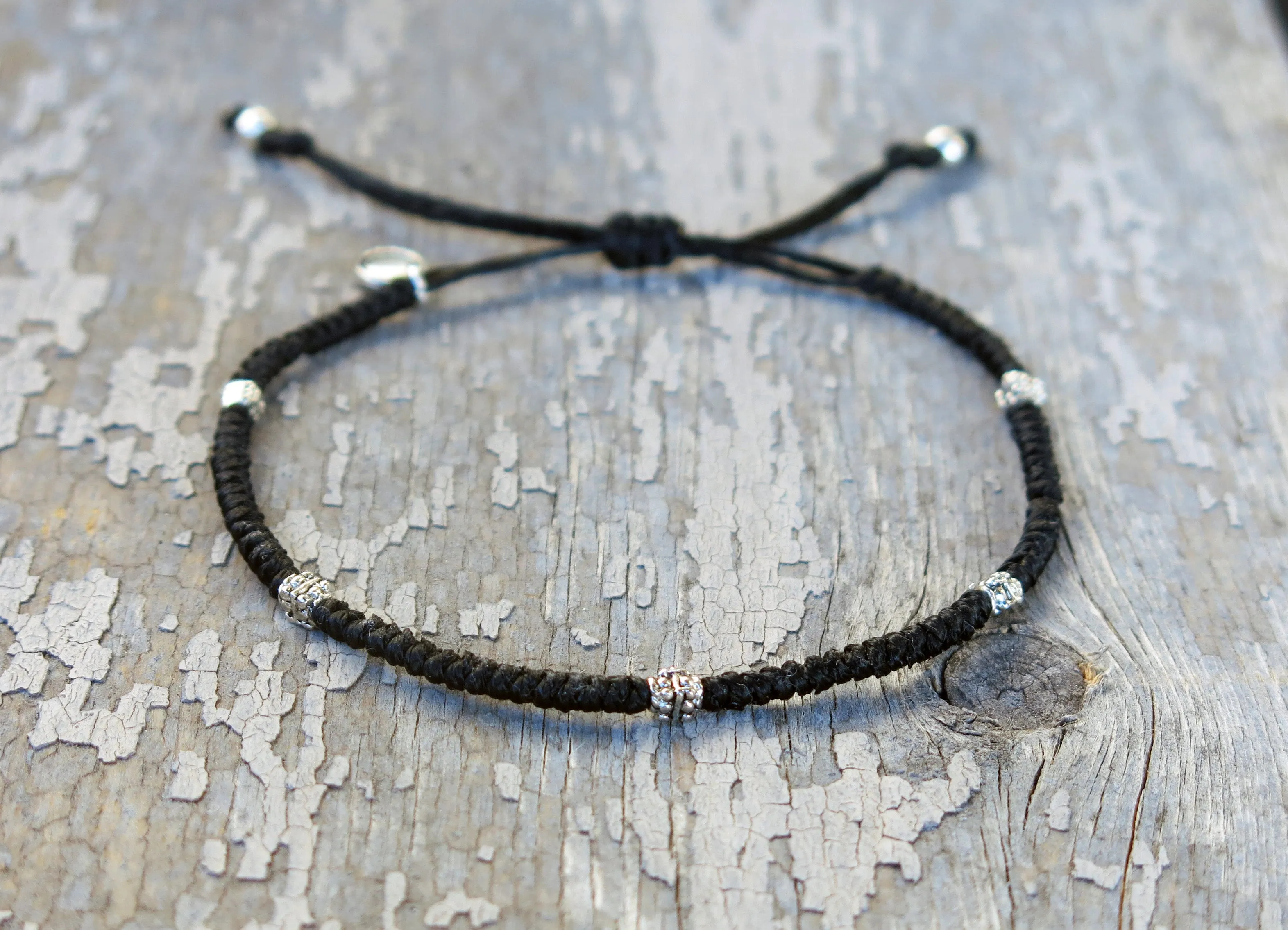AZOE - Minimalist knotted bracelet with adjustable sliding knot for closure.