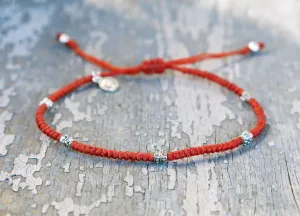 AZOE - Minimalist knotted bracelet with adjustable sliding knot for closure.