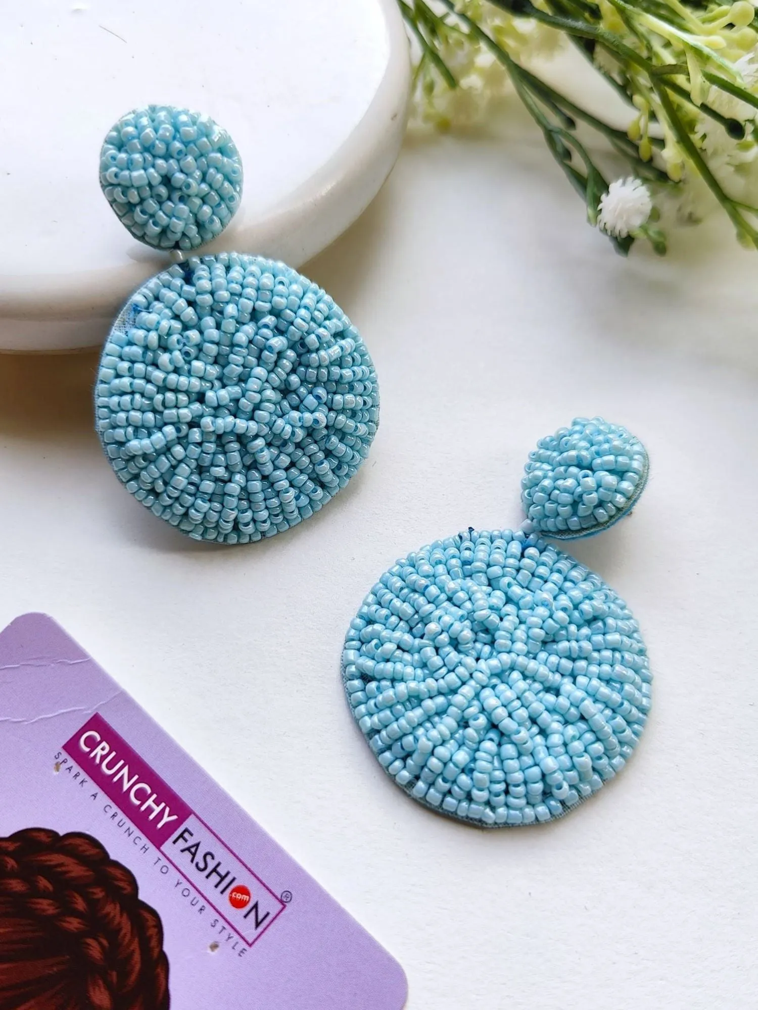 Handcrafted Sky Blue Beaded Danglers: A Fashionista's Statement Earrings