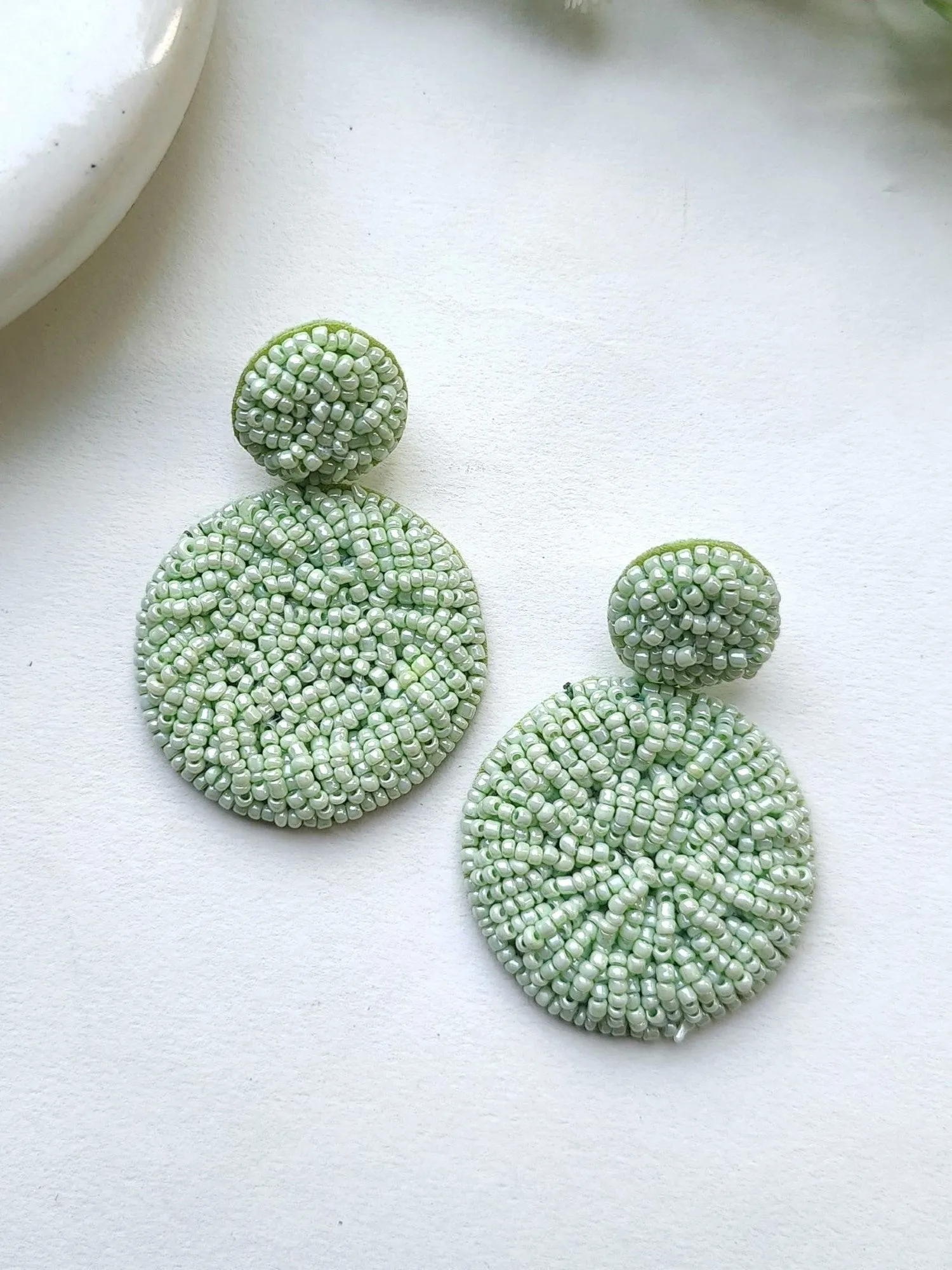 Handcrafted Sky Blue Beaded Danglers: A Fashionista's Statement Earrings