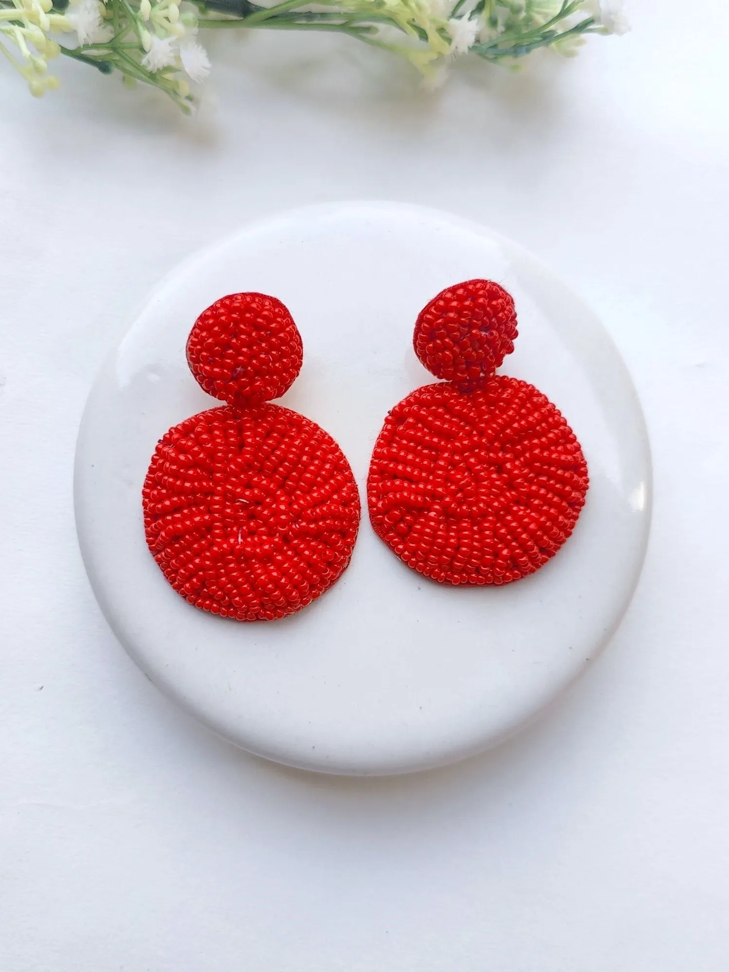 Handcrafted Sky Blue Beaded Danglers: A Fashionista's Statement Earrings