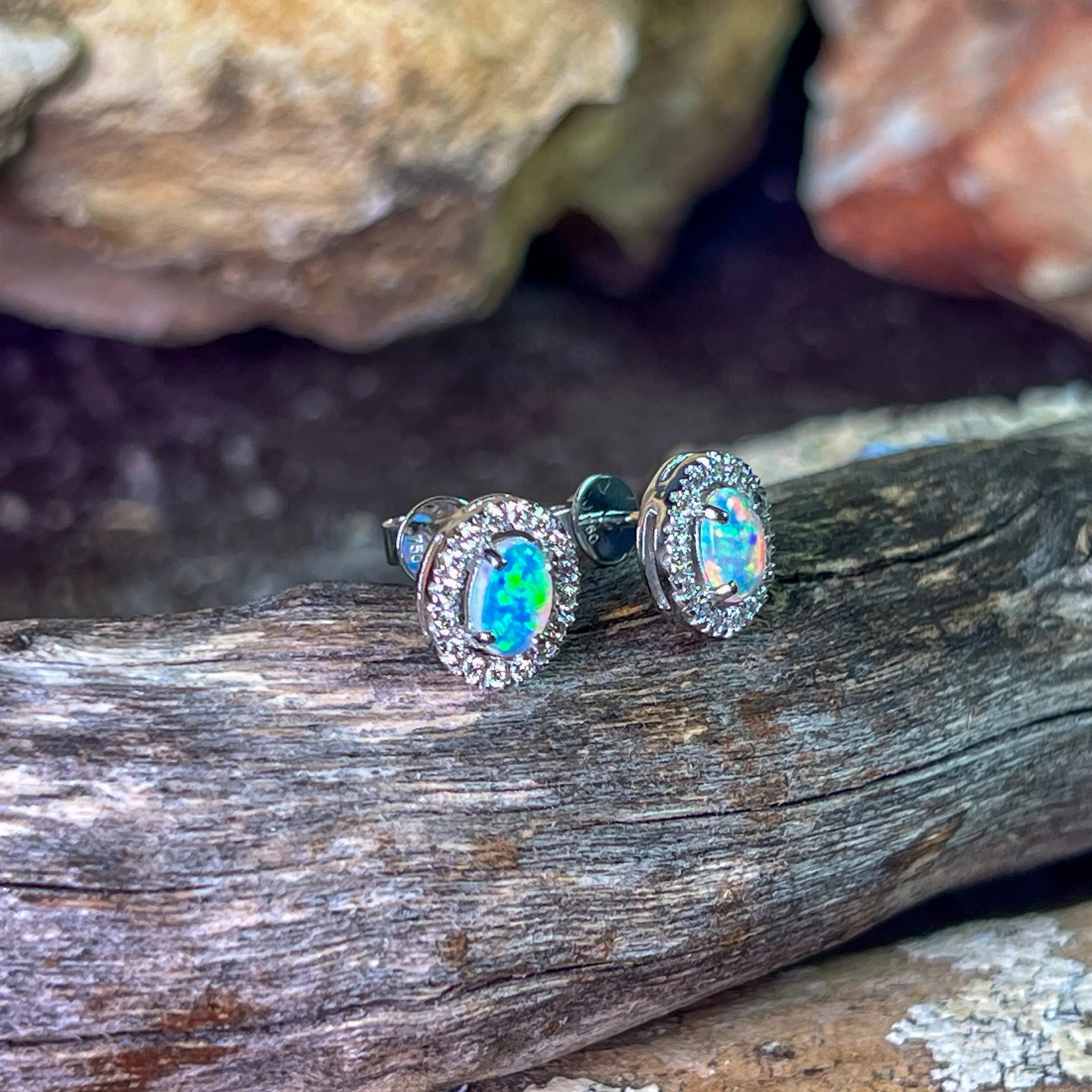 Pair of 18kt White Gold halo Opal and diamond studs