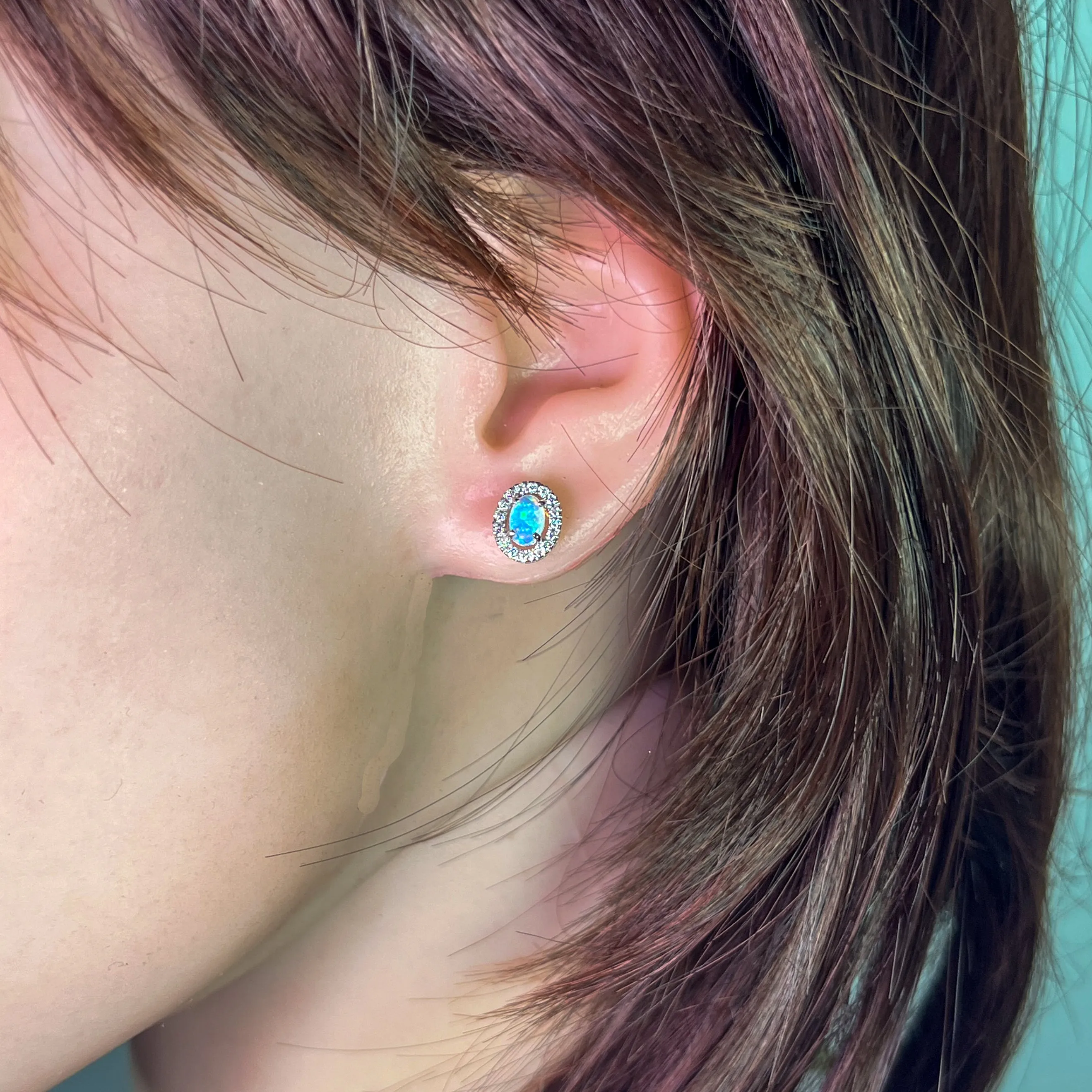 Pair of 18kt White Gold halo Opal and diamond studs