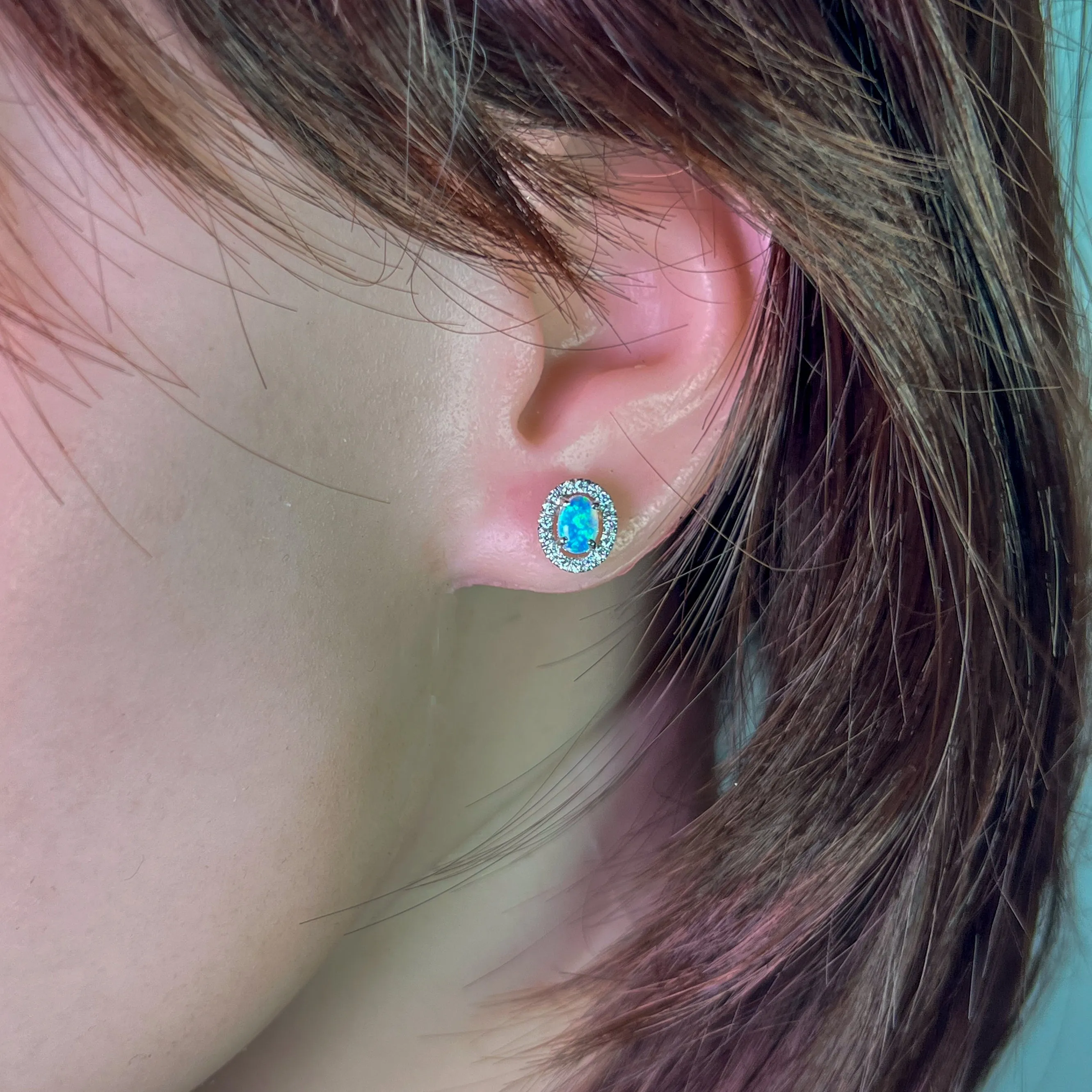 Pair of 18kt White Gold halo Opal and diamond studs