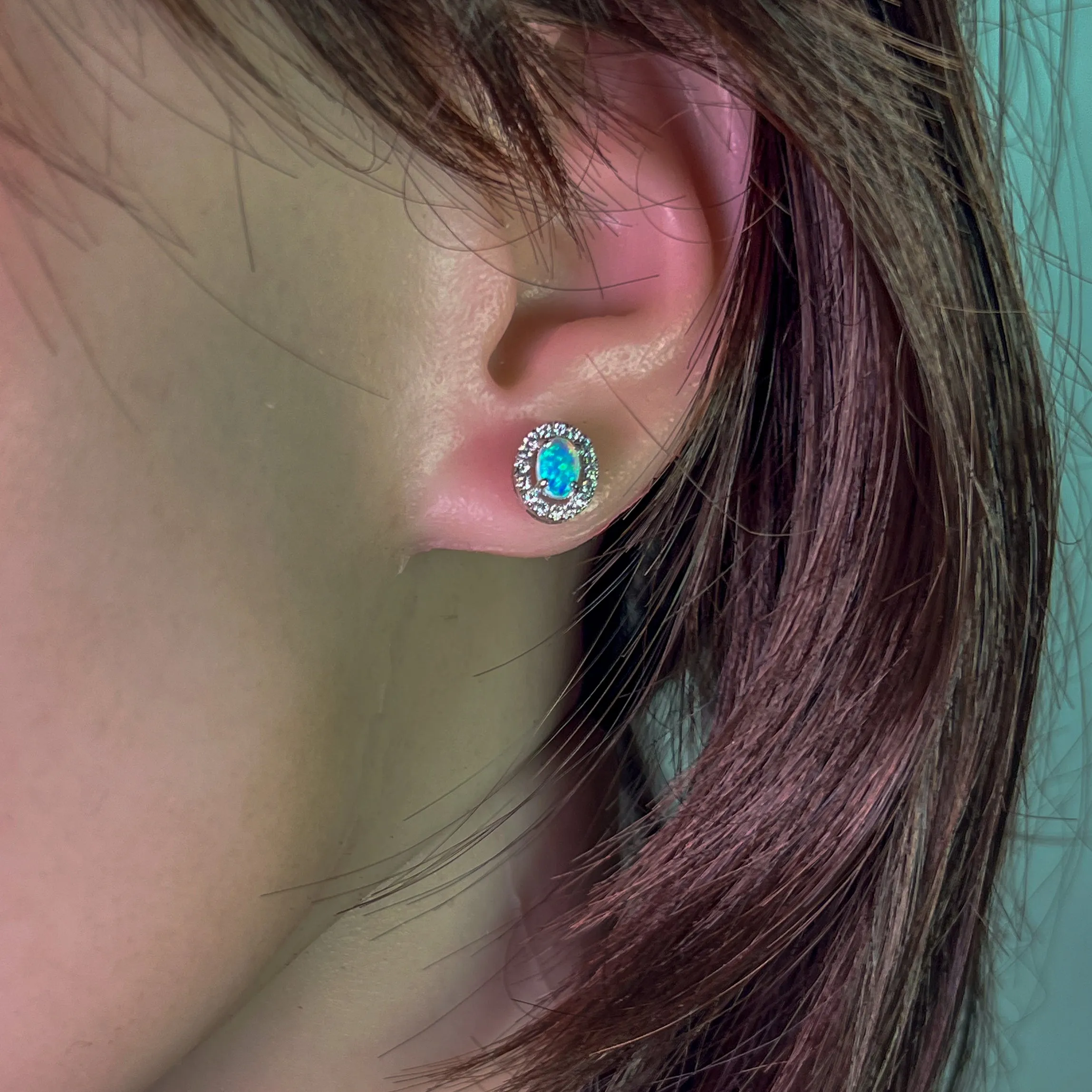 Pair of 18kt White Gold halo Opal and diamond studs
