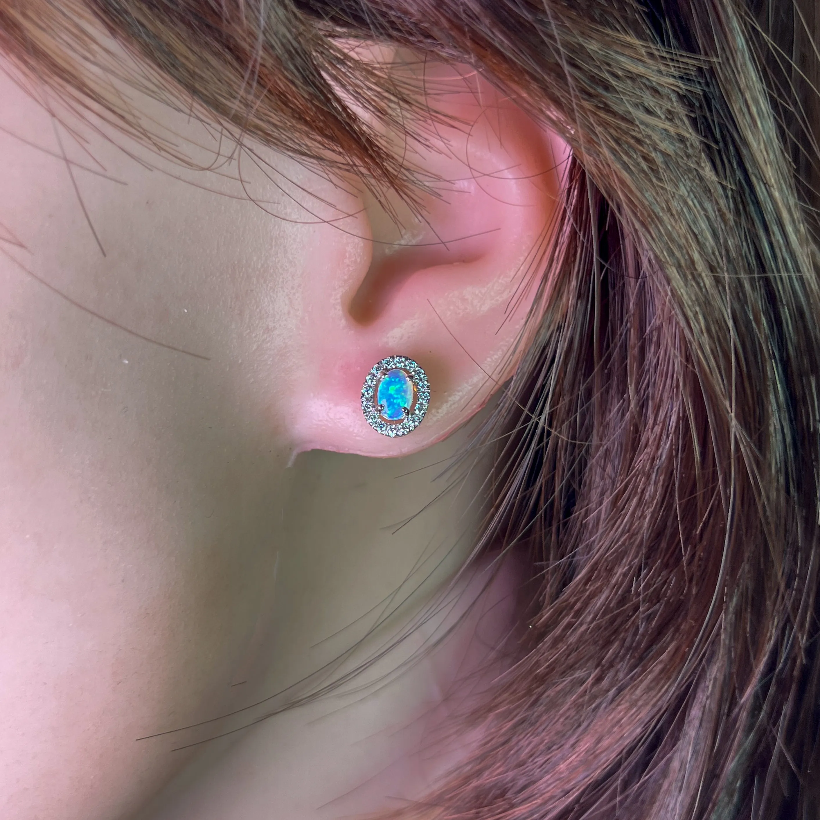 Pair of 18kt White Gold halo Opal and diamond studs